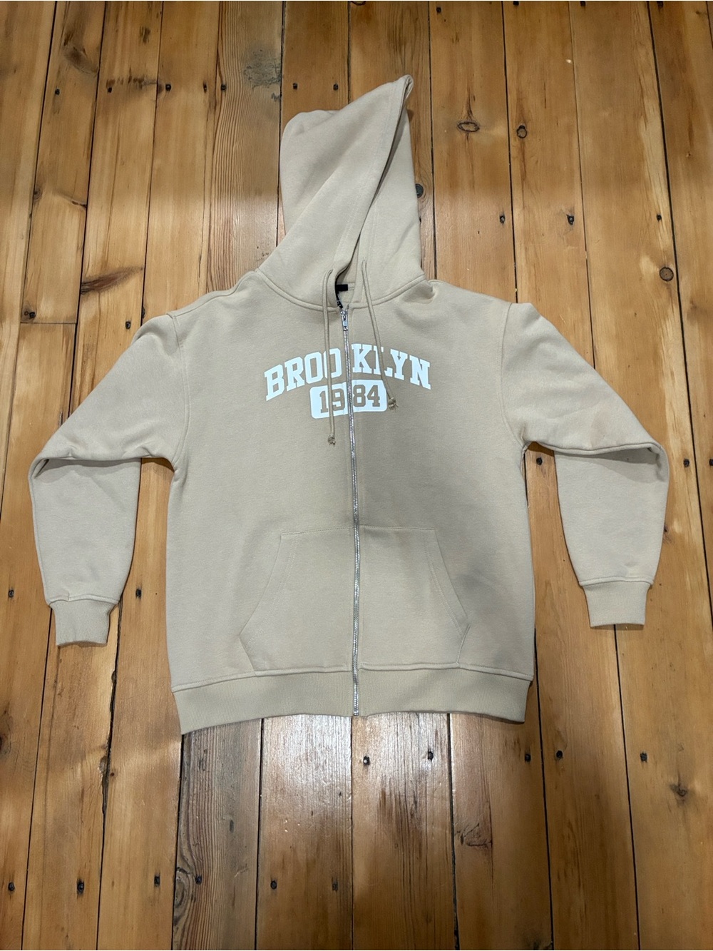 Forever 21 Kids Beige Zip-Up Hoodie with White 'Brooklyn 1984' Print